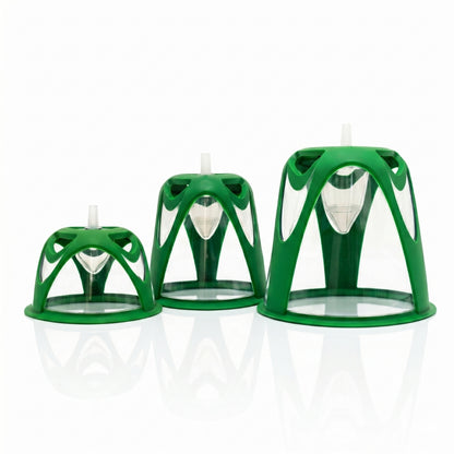 Three green pet oxygen masks on a white background